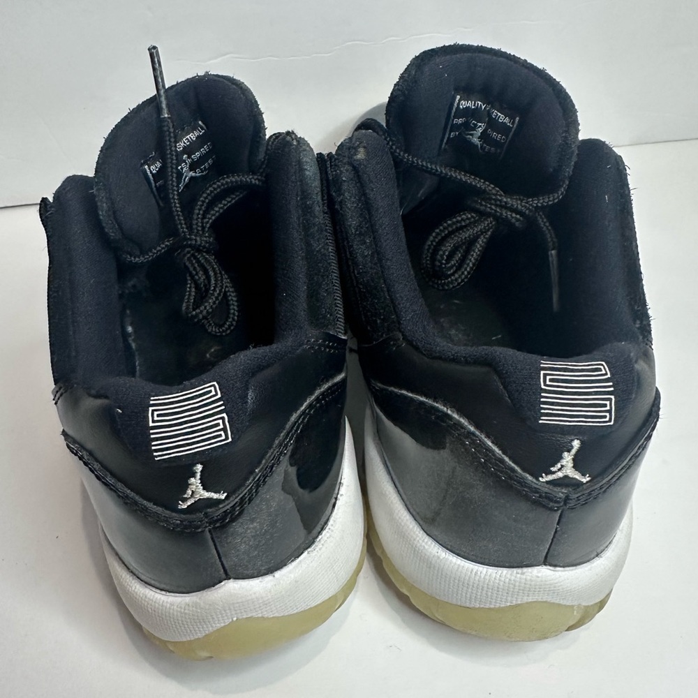 Kids Black and White Jordan 11 Sneakers - Picture 4 of 8